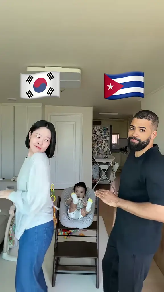 Living-Room Partners: Two adults share a living-room dance with shoulder pulses and playful gestures.